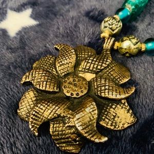 Teal glass beaded necklace with gold 🌸 flower